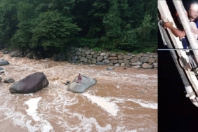 Derenin-ortasinda-mahsur-kalan-2-kisi-beton-pompasi-ile-kurtarildi.jpg